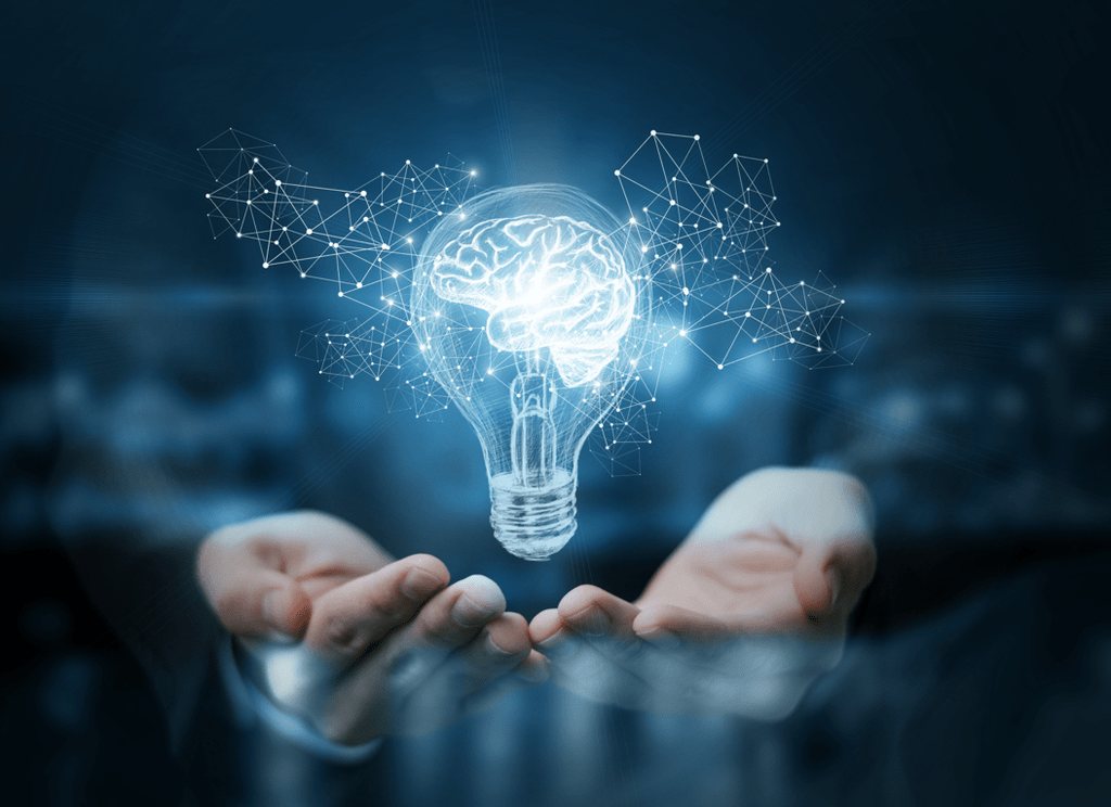 A glowing outline of a brain held in two open hands